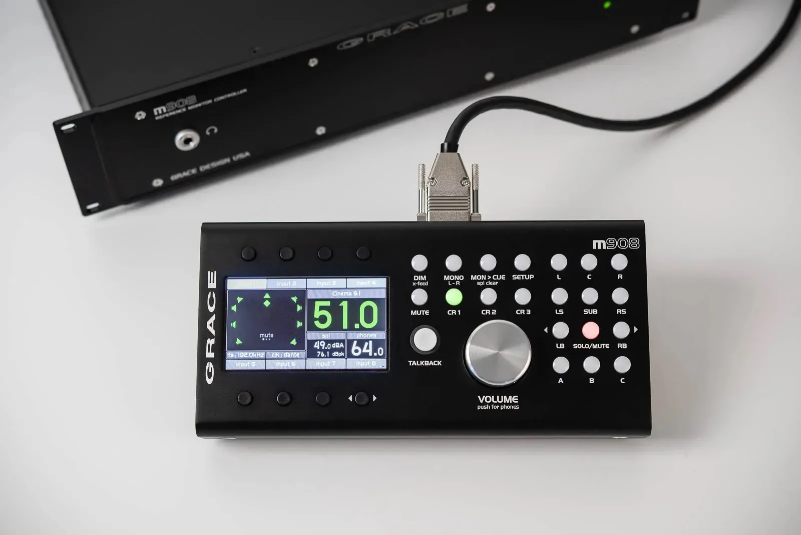 Grace Design m908 remote control unit with display screen alongside rackmount main frame unit.