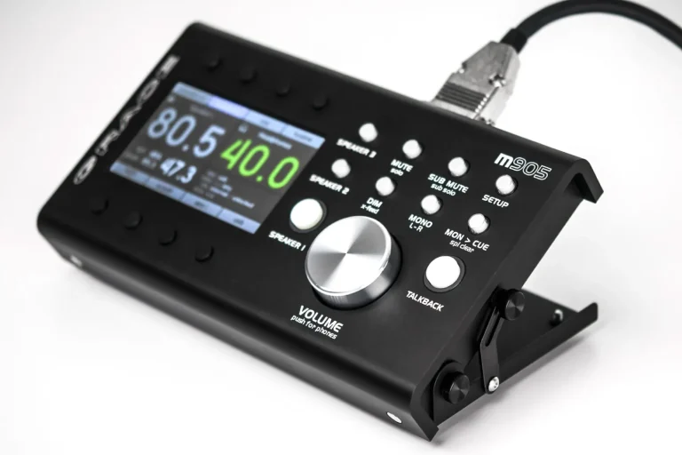 Close-up of a Grace Design m905 monitor controller showcasing its digital display, volume knob, and