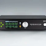 Front view of the black Grace Design m701 rackmount audio interface with color display and control knob.